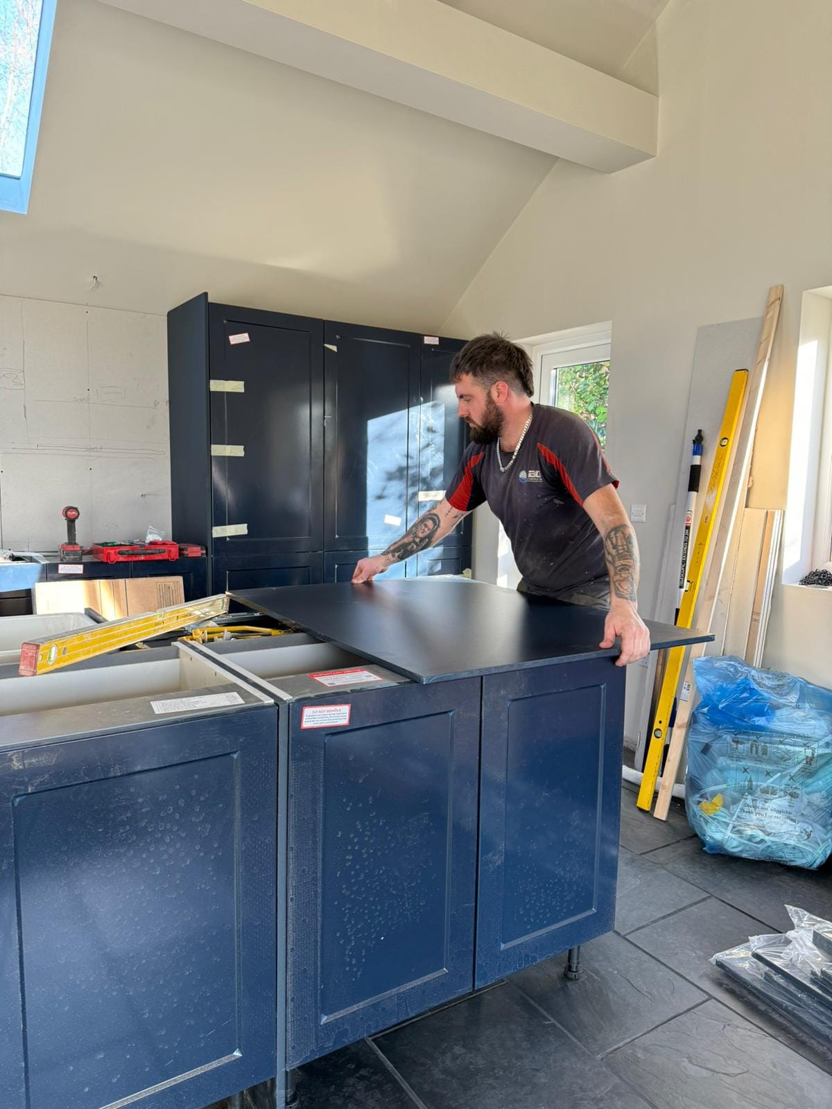 Towy Services craftsman installing kitchen island